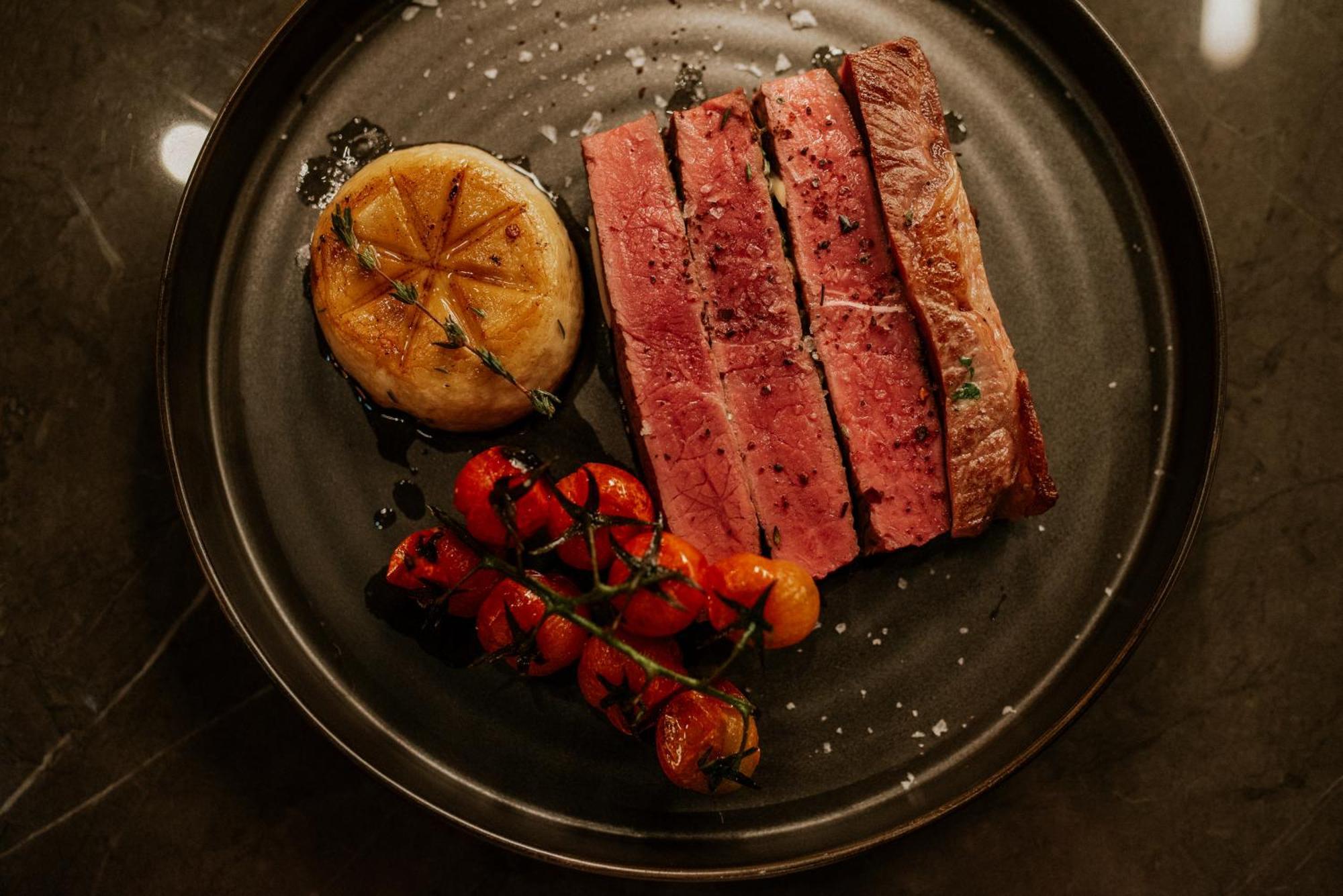 Kozmo Hotel Suites & Spa - Small Luxury Hotels Of The World Budapest Exterior photo A steak prepared at the restaurant